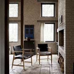 Borge Mogensen Huntsman Chairs black leather by fireplace Carl Hansen & Son