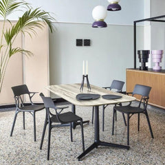Kartell A.I. Chairs by Philippe Starck in room with terrazzo floors
