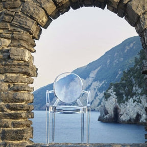 Kartell Louis Ghost Chair on Italian Cliffside by Ocean