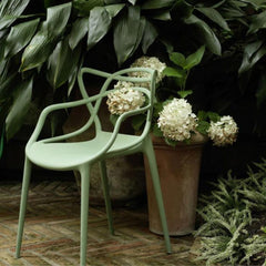 Kartell Masters Chair Sage Green Outdoors with Plants and Hydrangeas