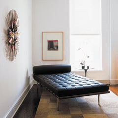 Knoll Barcelona Couch Black Leather in room with Saarinen side table