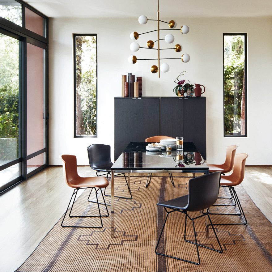 https://www.paletteandparlor.com/cdn/shop/products/knoll-bertoia-leather-side-chairs-dark-brown-and-black-leather-black-base-with-florence-knoll-dining-table-with-grigio-marquina-marble-top_880x.jpg?v=1673988907
