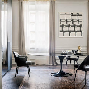 Knoll Saarinen Oval Dining Table Black Polished Nero Marquina Marble in room with Saarinen Executive Dining Chairs
