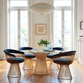 Knoll Platner Dining Table Gold in room with Platner Armchairs