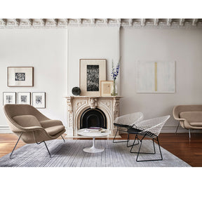 Knol Saarinen Womb Settee in room with Two-Tone Bertoia Diamond Chairs