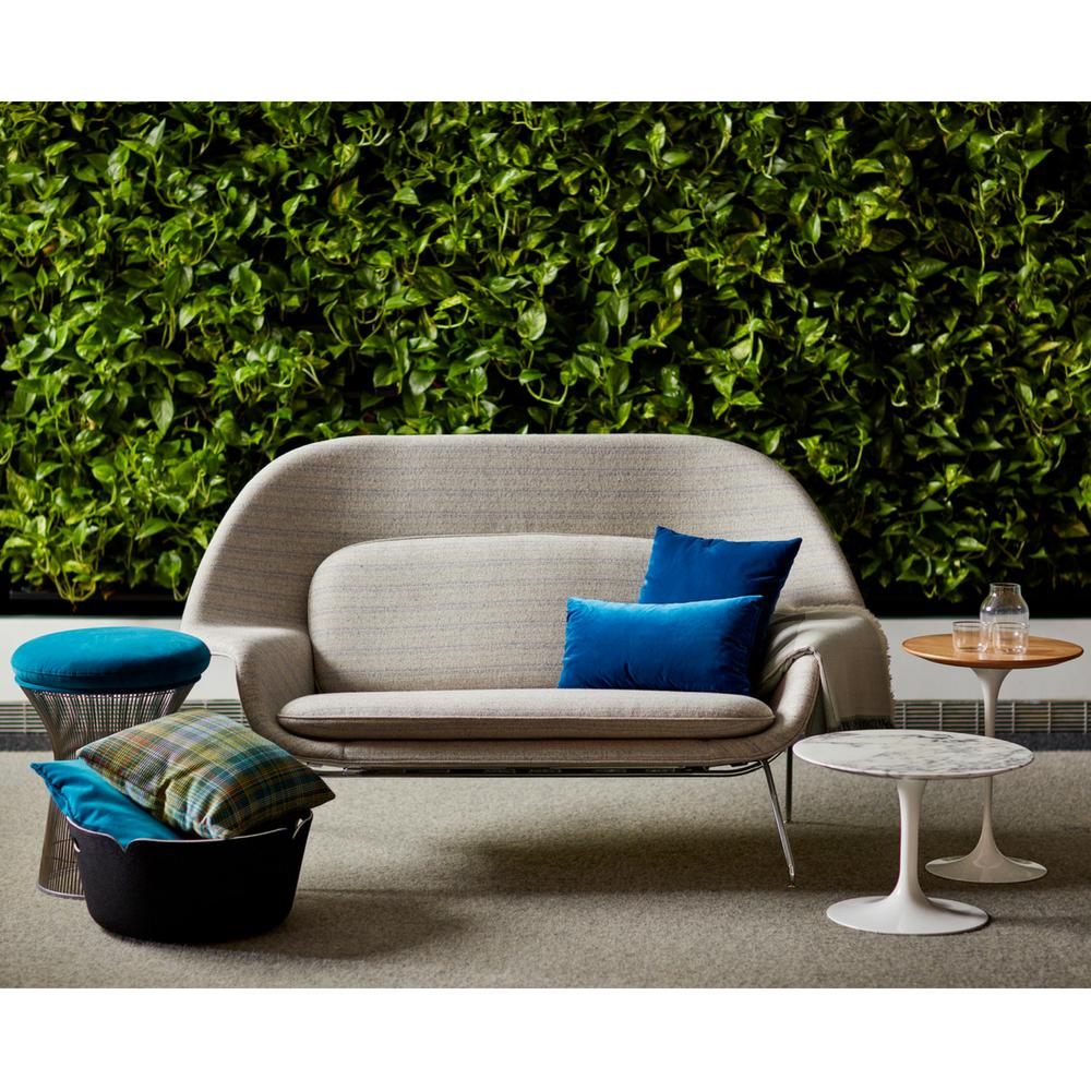 Knoll Saarinen Womb Settee styled with living wall and Tulip Tables