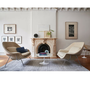 Knoll Saarinen Womb Settees in Room with Tulip Side Table