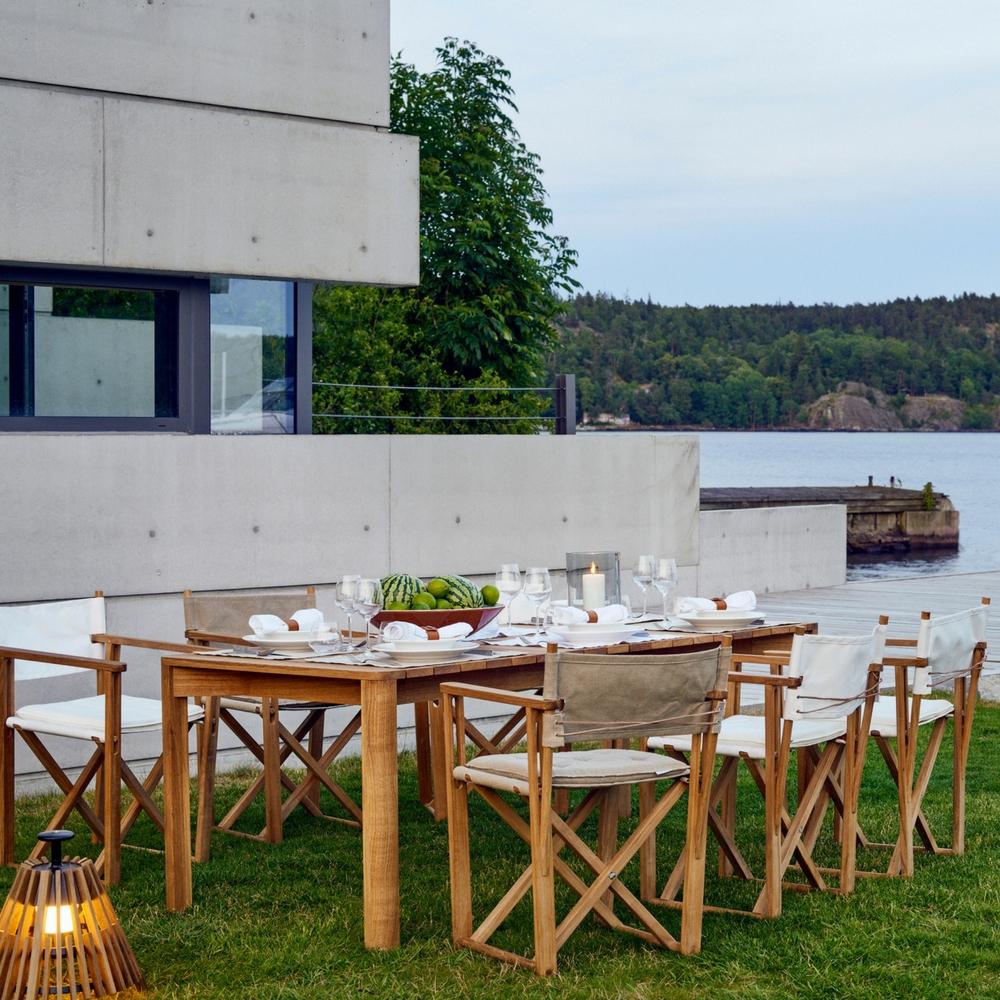Al Fresco Dining with Kryss Dining Chairs, Korso Dining Table, Möja Candle Lantern, and Tipi Lamp by Skargaarden