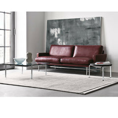 Piero Lissoni Two Seat Sofa Burgandy Leather in Room with Poul Kjaerholm Table and Stool