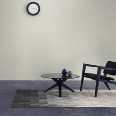 Linie Design Fade Grey Cowhide Rug in Room with Table and Chair