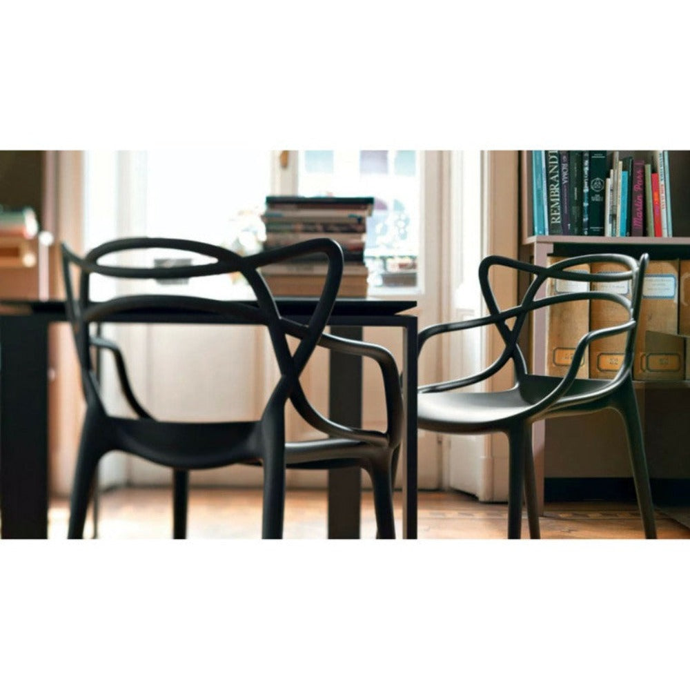 Black Masters Chairs at Table by Philippe Starck for Kartell Table