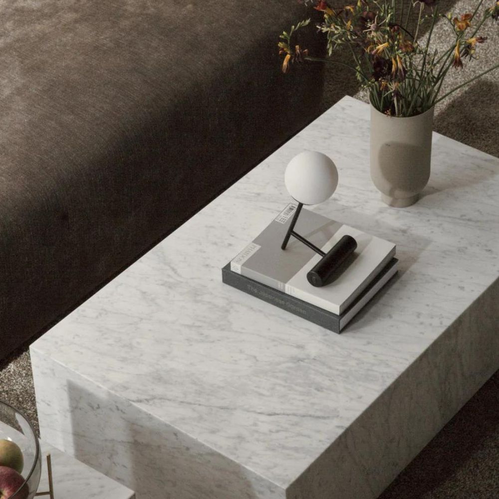Menu Plinth Marble Coffee Table with Flowers Books Table Lamp Norm Architects Copenhagen