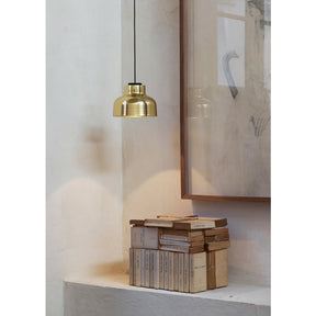 Miguel Milá M64 Polished Brass Suspension Lamp over Books by Santa & Cole