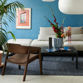 Muuto In Situ Modular Sofa in room with Cover Chair and Strand Pendant Lights