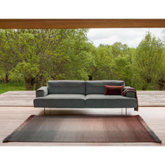 Nani Marquina Shade Rug Palette 4 Stormy Grey Sunset in situ with sofa