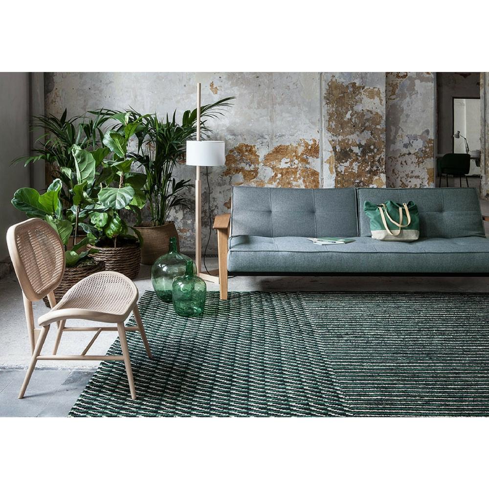 Nanimarquina Bouroullec Blur Rug Green in Room with Cane Chair and Sofa