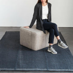 Nani Marquina Mia Rug Blue in Room with Pouf