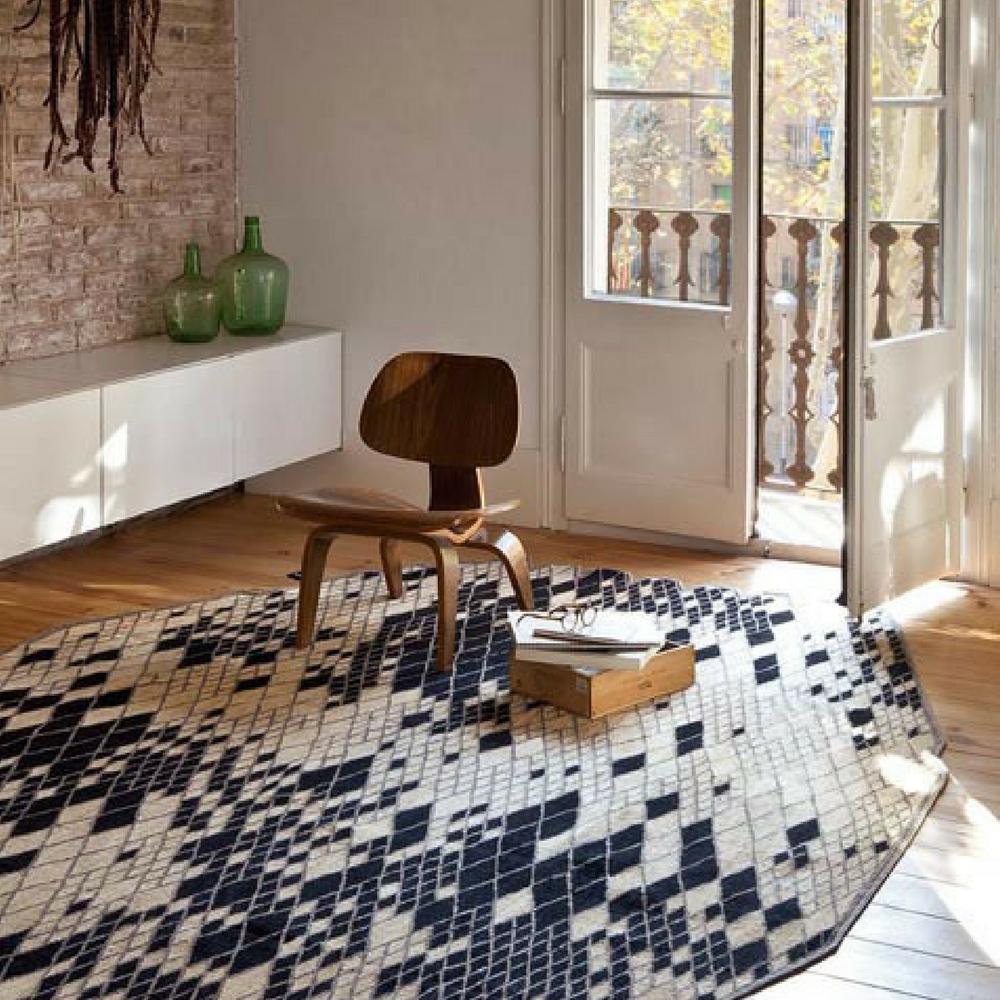 Nani Marquina Losanges Rug II in room with Eames Chair