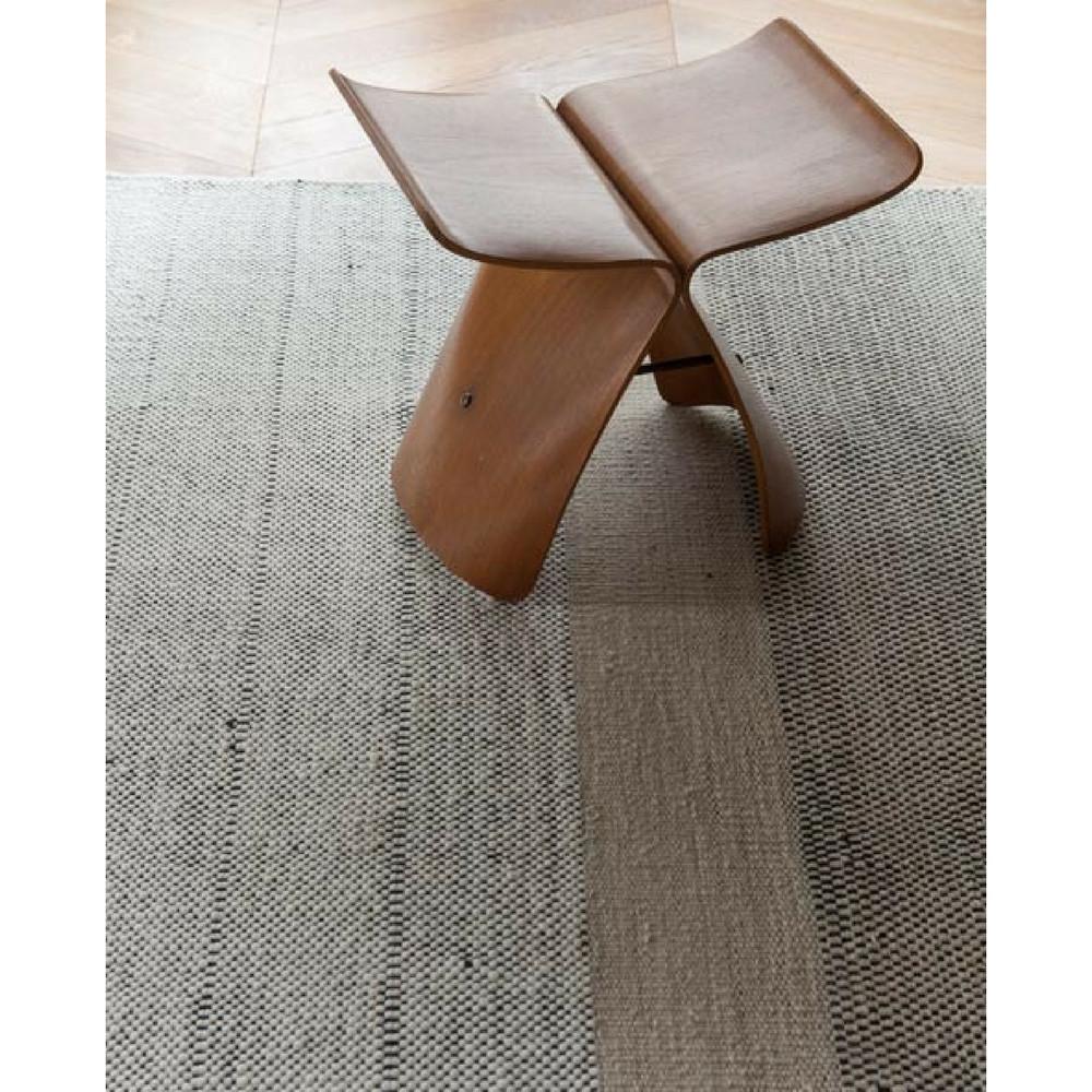 Nani Marquina Tres Rug in room with Sori Yanagi Butterfly Stool