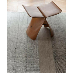 Nani Marquina Tres Rug in room with Sori Yanagi Butterfly Stool