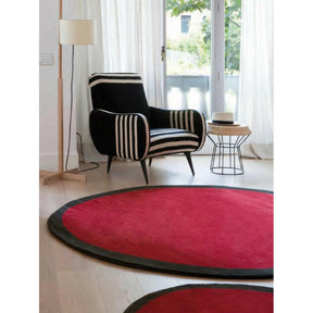 Nanimarquina Round Aros Rugs in room with Gio Ponti Chair