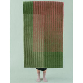 nanimarquina haze runner 3 with woman on mint green background