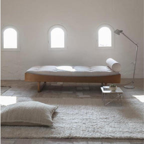 Nanimarquina Ilse Crawford Wellbeing Mazari Floor Cushion in Room with Wool Chobi Rug
