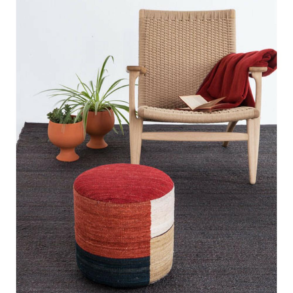 Nanimarquina Kilim Pouf in room with CH25