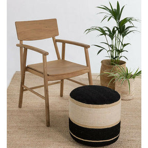 Nanimarquina Kili Pouf 1 in room with wood chair