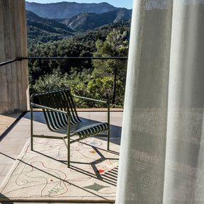 Nanimarquina Silhouette Outdoor Rug by Jaime Hayon with Hay Palisade Chair on Deck