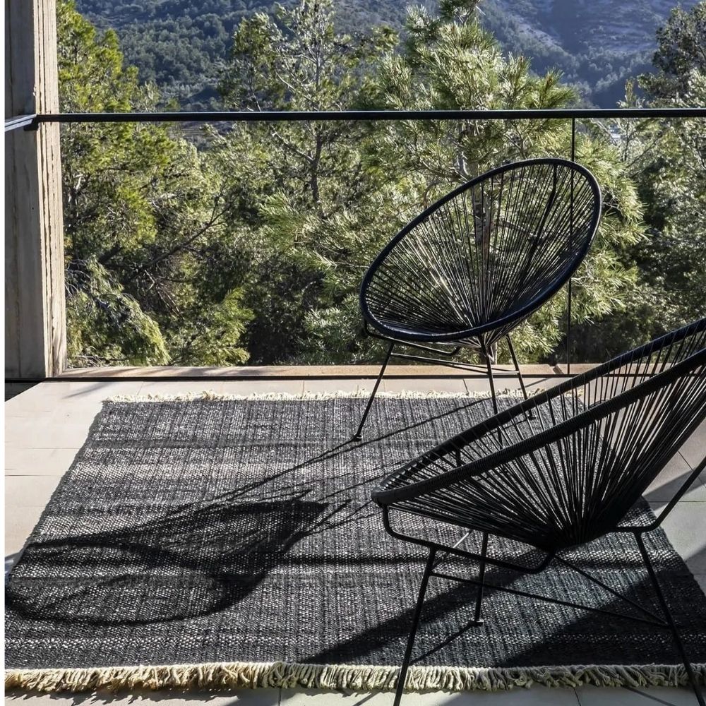 Nanimarquina Tres Outdoor Texture Rug Black on Balcony