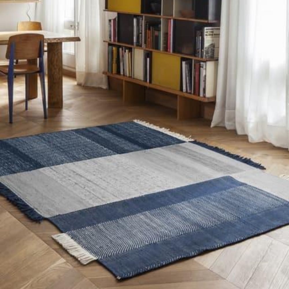 Nanimarquina Tres Rug Blue in room with Prouve Standard Chair