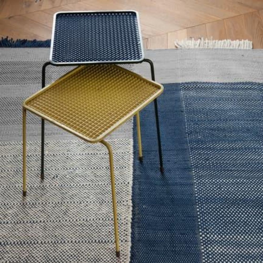 Nanimarquina Tres Rug Blue in room with metal stools