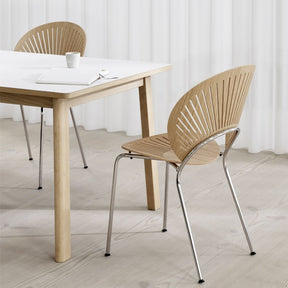 Trinidad Chair by Nanna Ditzel for Fredericia in Oak Lacquer with Chrome Frame shown with Ana Dining Table by Fredericia