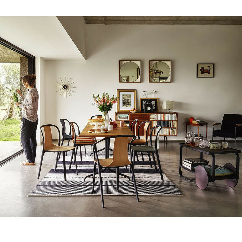 Vitra Nelson Star Clock in room with Belleville chairs and dining table by Ronan and Erwan Bouroullec