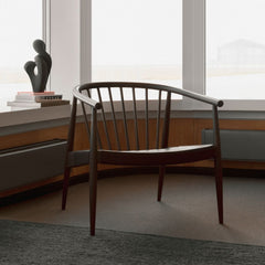Norm Architects Reprise Lounge Chair in Walnut with Hide Seat in Room