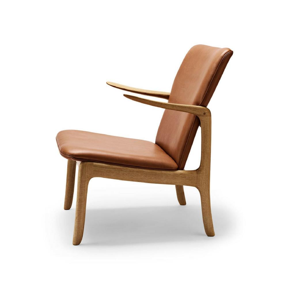 Ole Wanscher Beak chair in cognac leather with oak frame side view Carl Hansen and Son