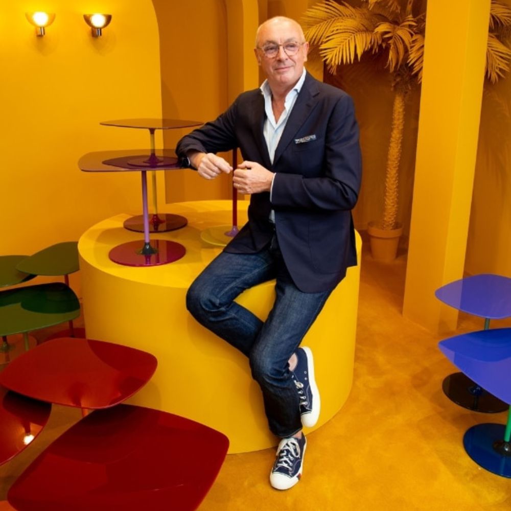 Piero Lissoni with the Thierry Side Tables he designed for Kartell
