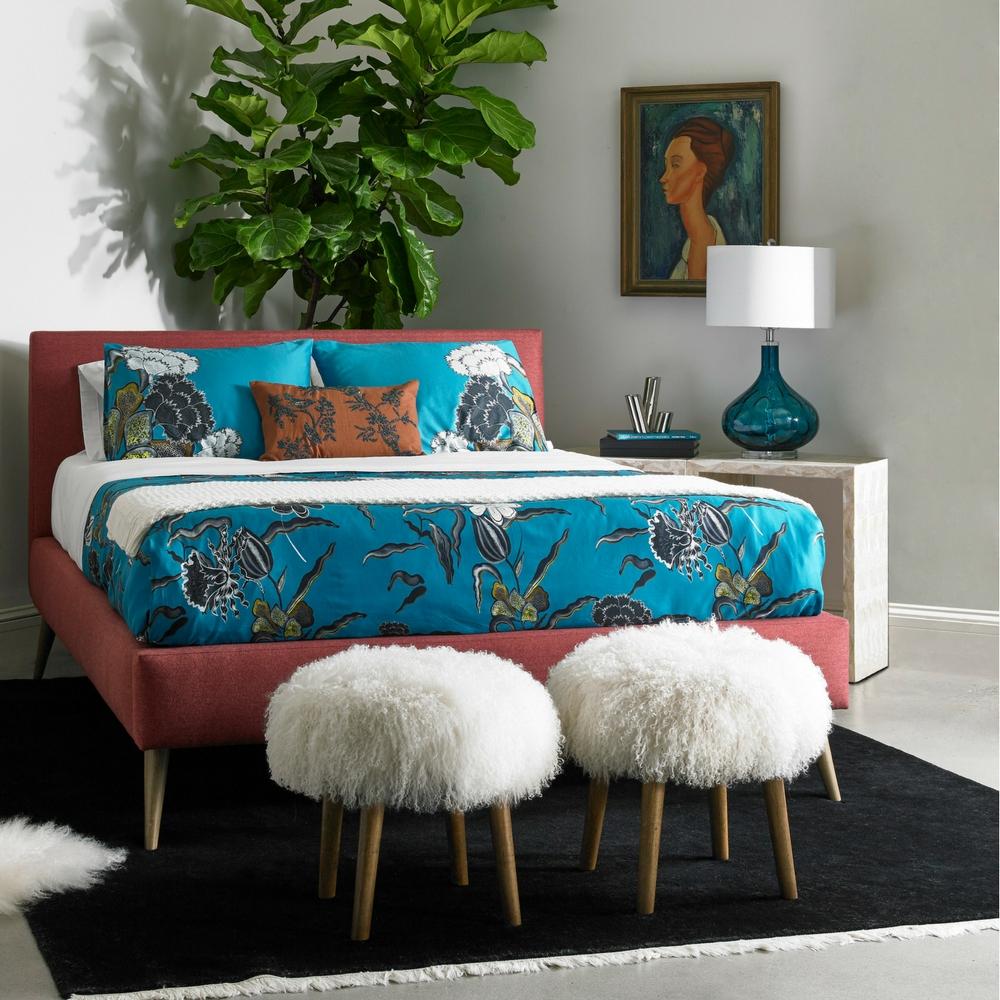 Precedent Furniture Roxanne Platform Bed in room with Sheepskin Ottomans