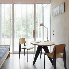 Prouve Small Gueridon Table in room with Standard Chairs and Artemide Tolomeo Table Lamp Vitra