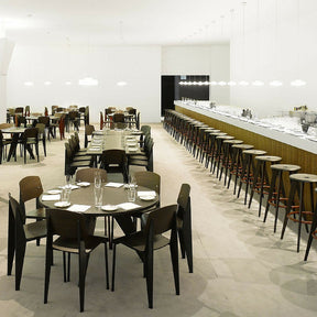 Prouve Tabouret Haut Bar Stools in Office Cafe with Standard Chairs and Gueridon Tables Vitra