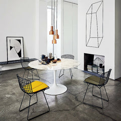 Marble Saarinen Dining Table in room with Black Bertoia Chairs Knoll
