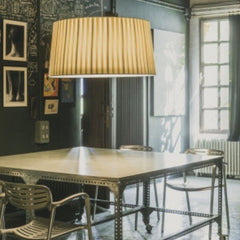 Santa Cole GT7 Suspension Lamp in room with Toledo Chairs