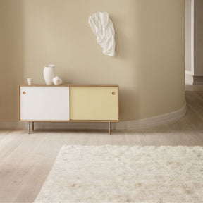 White Magnolia Vase by Naja Utzon Popov with No 11 Sideboard by Sibast Furniture