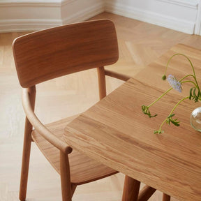 Skagerak Hven Dining Table and Chair in Situ with flowers