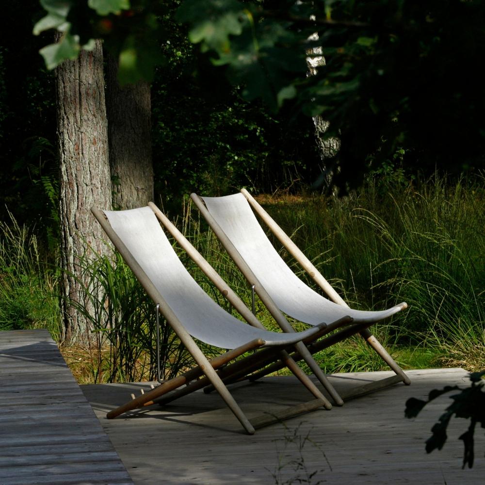 Skargaarden H55 Lounge Chairs outdoors on deck in shade