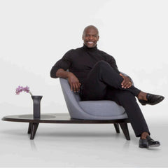 Terry Crews sitting on the Lilypad he designed for Bernhardt Design