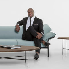 Terry Crews with the Float Tables and Ibis Sofa he created for Bernhardt Design