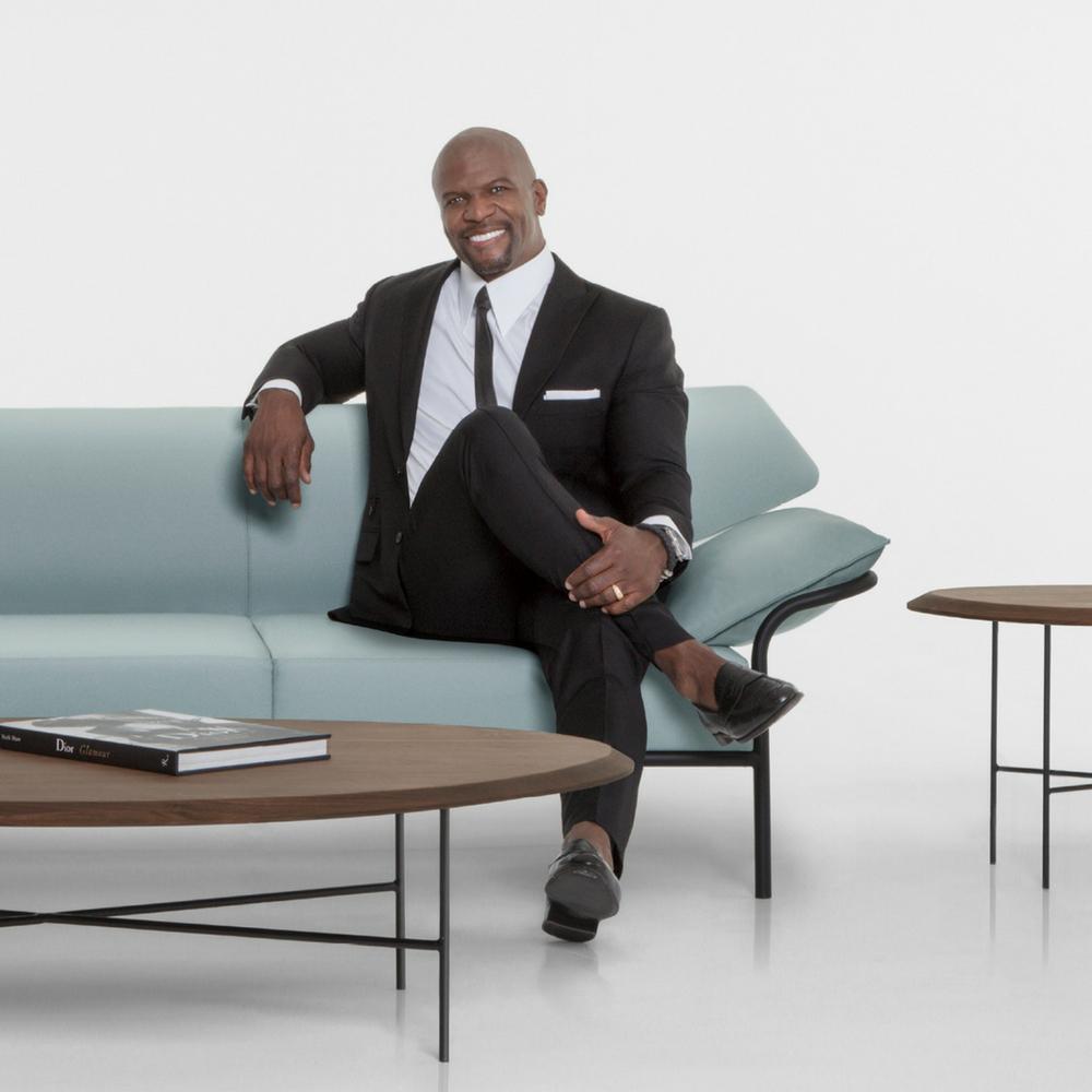 Terry Crews with the Ibis Sofa he designed for Bernhardt Design