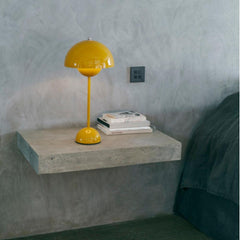 Verner Panton VP3 Flowerpot Lamp in Mustard Yellow Styled on Concrete Shelf And Tradition Copenhagen